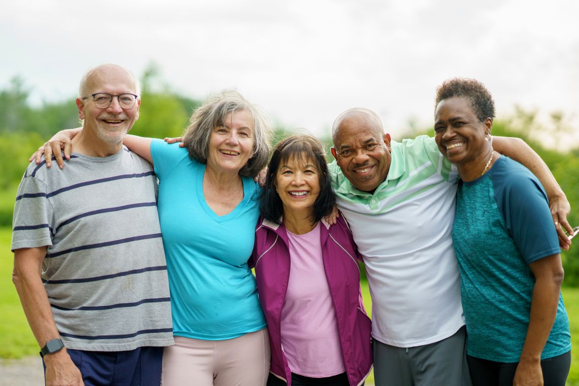 Group of individuals enjoying time together, smiling warmly