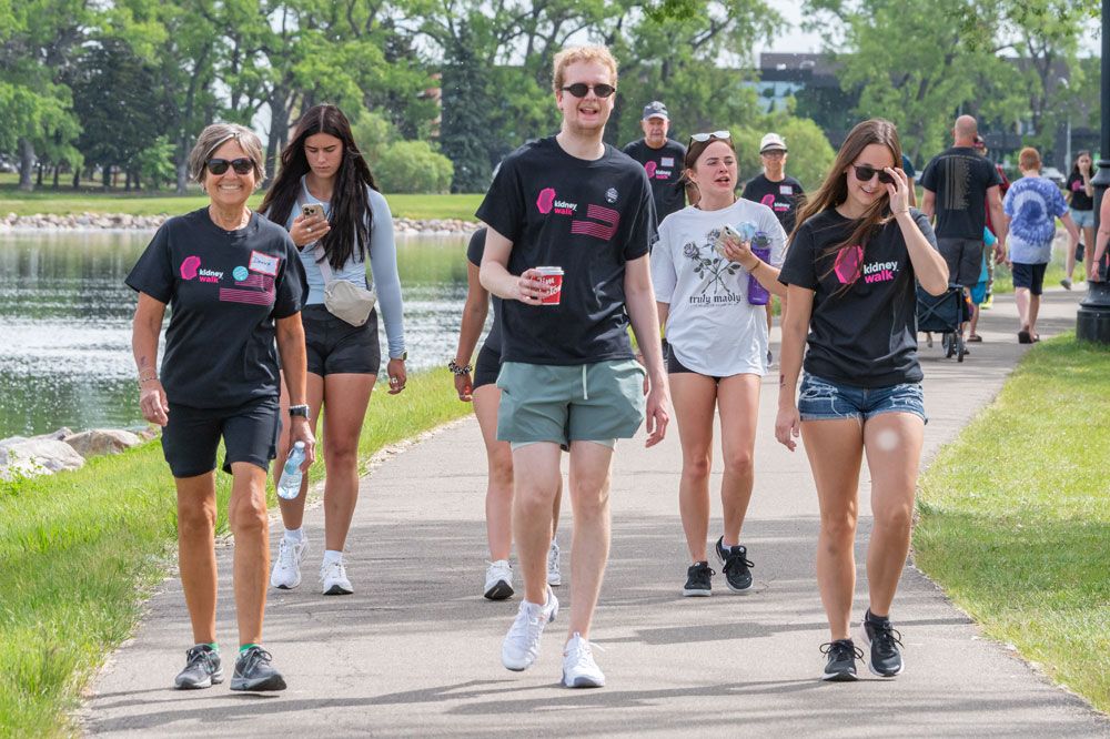 A group of Kidney Walk participants walking on an outdoor path