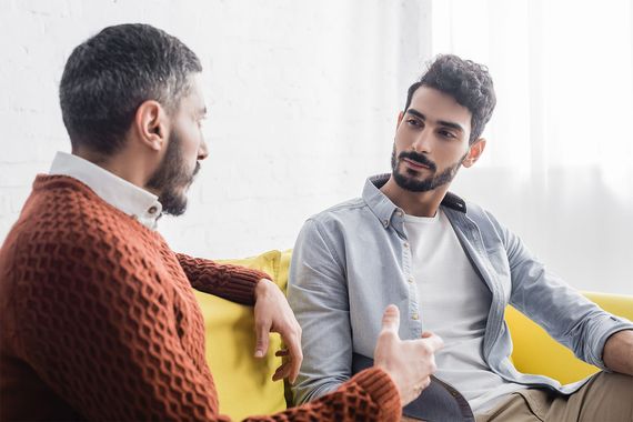 Two young men talking