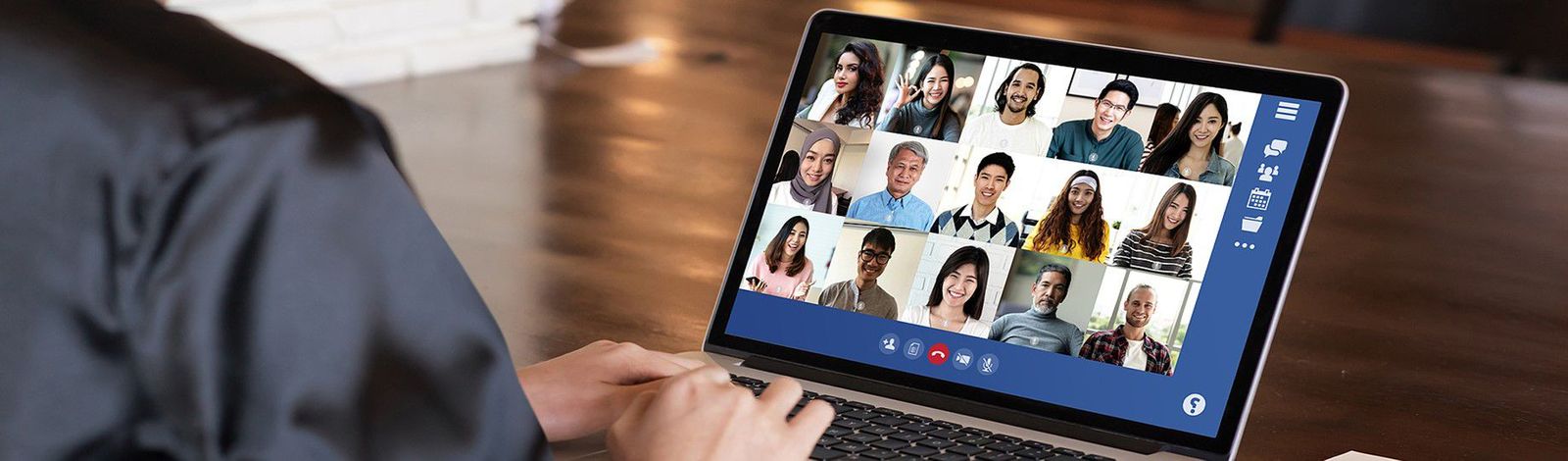 A man having a virtual meeting on his laptop