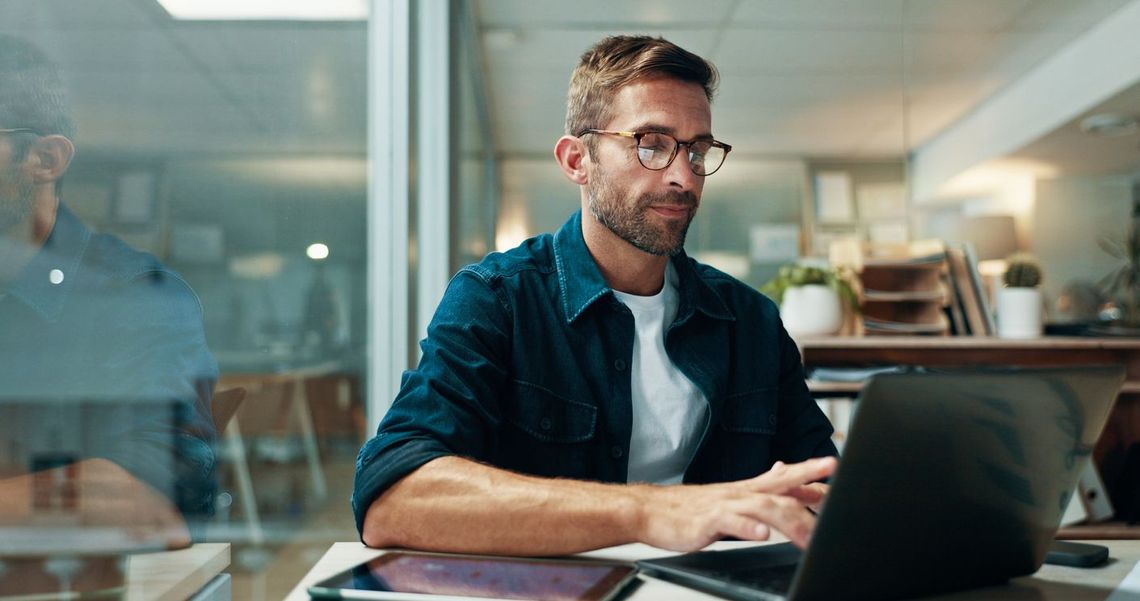 A man working on his laptop computer