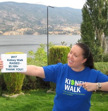 Annick holding a pointing a sign