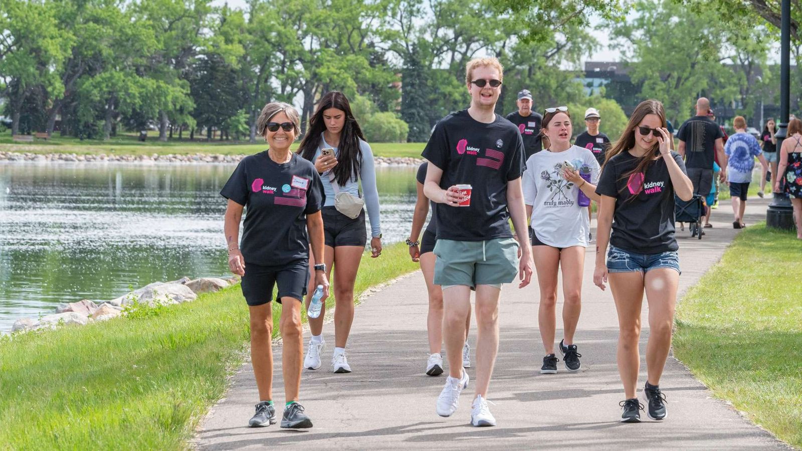 Participants of the 2025 Kidney March walking in a park.
