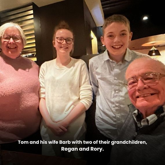 Tom and his wife Barb with two of their grandchildren, Regan and Rory.