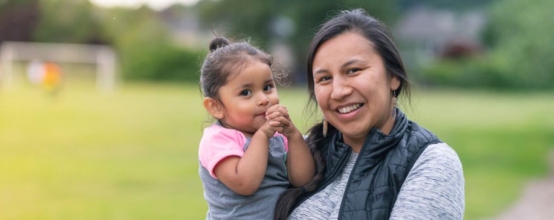 A woman holding her daughter